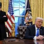 image for President (standing)and spokesperson(sitting) during EO event