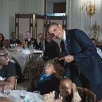 image for Kid fell asleep during an event at the White House, and Obama took a photo with him