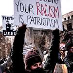 image for A person holding a protest sign in Indianapolis expressing displeasure with the state of the union.