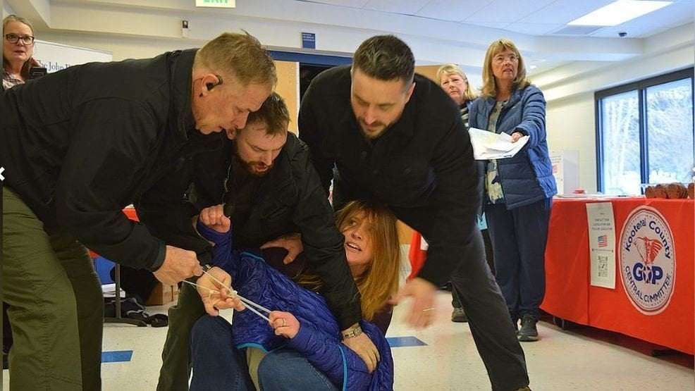 image for Coeur d'Alene town hall turns chaotic as woman forcibly removed