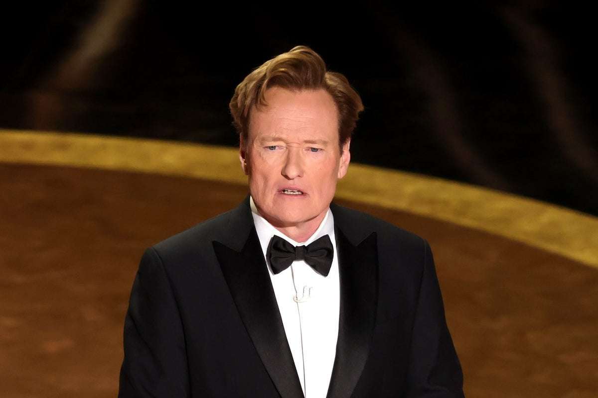 image for Oscars’ host Conan O’Brien draws resounding applause for crack about ‘standing up to a powerful Russian’