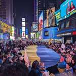 image for Crowd unfurls a Ukrainian flag at Times Square March 1st 2025