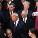 image for Rep. Melanie Stansbury, D-N.M., holding a sign before Trump delivers joint address to Congress