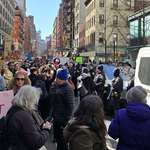 image for NYPD protecting a parked Tesla during Women's March after not blocking traffic to protect protestors