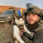 image for A Ukrainian soldier and his cat stand on the frontline, ready to fight until the very end.