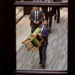 image for Outgoing Canadian Prime Minister Justin Trudeau carries his seat from the House of Commons