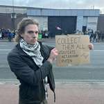 image for Man raises a sign outside of Scheveningen prison in the Hague, Netherlands.