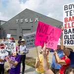 image for Protesters outside a Tesla service center in New Orleans, Louisiana