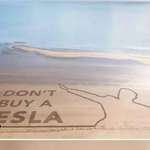 image for A 250m long "Don't buy a Tesla" message raked into sand on a Welsh beach using a Tesla car!