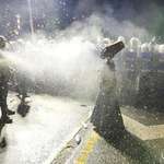 image for A dervish wearing a gas mask is pepper-sprayed by police during protests in Istanbul, Ümit Bektaş