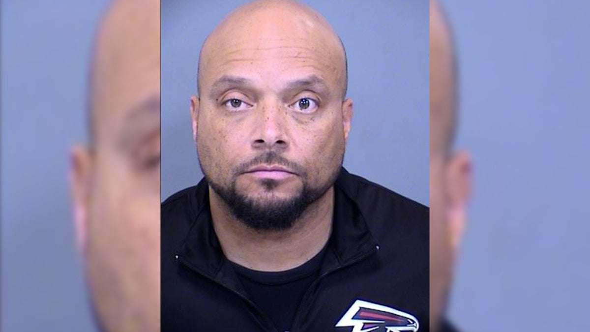 image for Phoenix teacher arrested after allegedly peeing into a can while at his desk