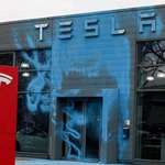 image for Berlin protesters following Swedens example, coloring Tesla showroom in the colors of the AfD