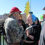 image for A protestor and armed counter-protestor argue at a protest in Idaho Falls, Idaho on April 5. (OC)