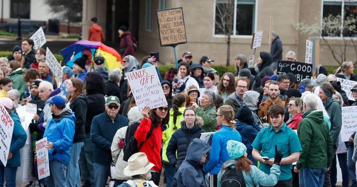 image for Bloodied Trump Fan Pulls Rifle in Anti-MAGA Clash at Indiana Protest