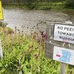 image for Sign between Norway and Russia Border saying "No peeing towards Russia"