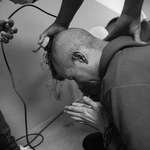 image for Andry Romero, a gay makeup artist sent to El Salvador, sobbing and praying as guards shave his head.