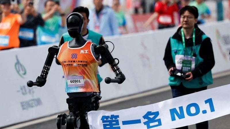 image for Chinese robots ran against humans in the world’s first humanoid half-marathon. They lost by a mile
