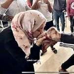 image for Kissing her dead son's foot