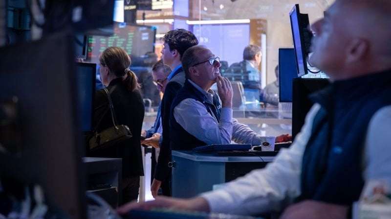 image for Stocks tumble and dollar hits three-year low as Trump bashes Powell again
