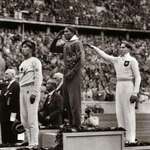 image for Jesse Owens USA salutes after defeating Nazi Germany’s Lutz Long in long jump, 1936 Berlin Olympics.