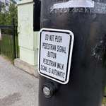 image for Removing the button had to be cheaper than the sign. There were 8 of these at the intersection.