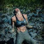image for A runner from the Fan Pin race, where they have to cross muddy rivers in Spain"