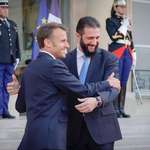 image for President of France embraces the president of Syria