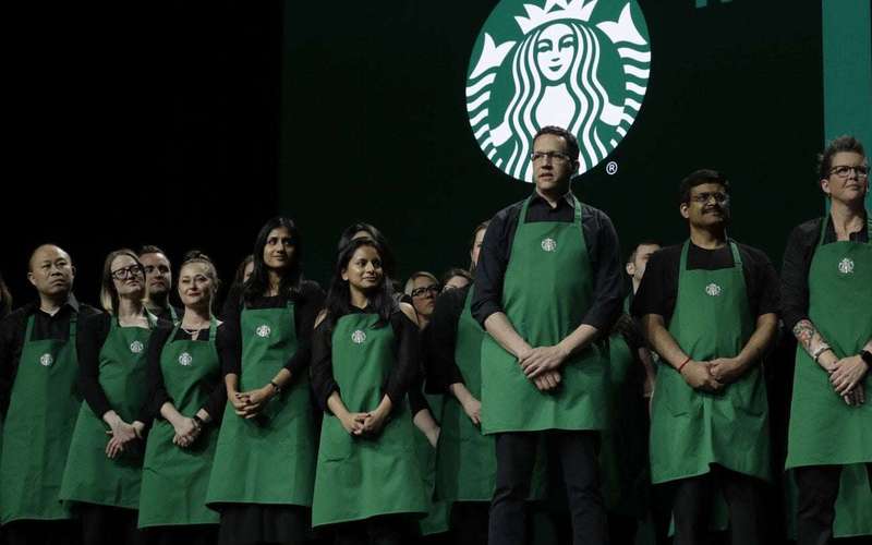 image for More than 1,000 Starbucks baristas go on strike to protest new dress code