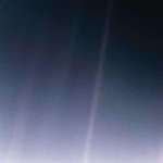 image for Earth from 6 billion km away — just a pale blue dot suspended in a sunbeam