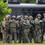 image for Law enforcement officers and the FBI near the scene of a shooting in Brooklyn Park, Minnesota, US