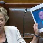 image for Ivana Bacik speaks while holding up meme of US VP JD Vance in Irish Parliament.
