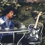 image for Jimi Hendrix taking tea with his Stratocaster - the day before he died aged just 27.