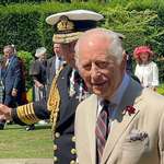 image for King Charles III, wearing a tan suit