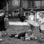 image for Children in France playing with a toy guillotine (1959)