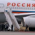 image for US Soldiers kneeling to roll out the red carpet for Putin while Russian bodyguards stand and watch.