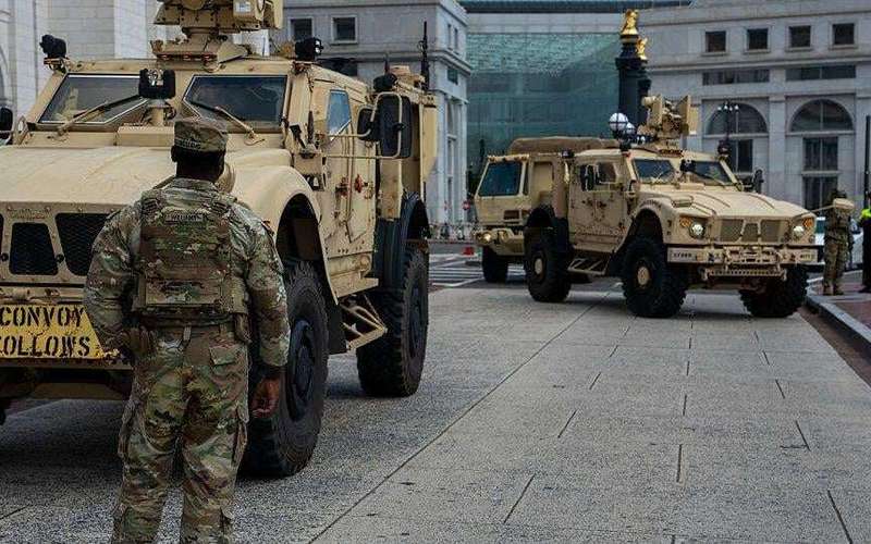 image for White House says National Guard members deployed to D.C. "may be armed"