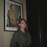 image for [OC] Iraqi Female Officer in Front of Saddam Hussein Portrait, 1991