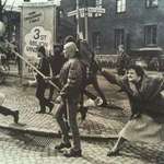 image for 1985: Swedish woman strikes a neo-Nazi with her handbag; her mother survived a concentration camp.