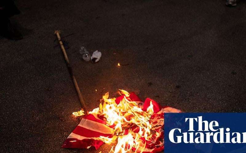 image for Trump signs order to criminally charge those who burn US flag in protest