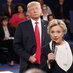 image for Candidate Trump following Candidate Clinton around the stage before hand bruising