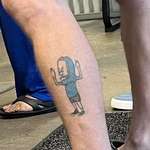 image for Saw this tattoo and got a chuckle.  Would love to know the backstory.