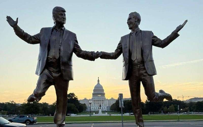 image for Mysterious new statue of Epstein and Trump holding hands appears on the National Mall