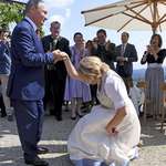 image for Austria's former foreign minister doing a curtsy for Putin at her own wedding.