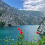 image for [OC] Red poppies overlooking a turquoise lake in Bosnia and Herzegovina