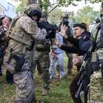 image for ICE aims gun at Americans