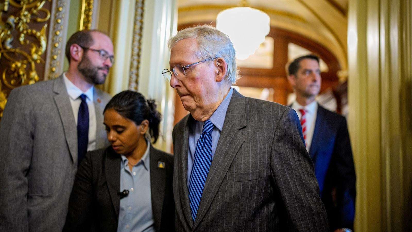 image for Sen. Mitch McConnell falls in Capitol hallway