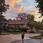 image for My wife showing our daughter the clouds right after it rained