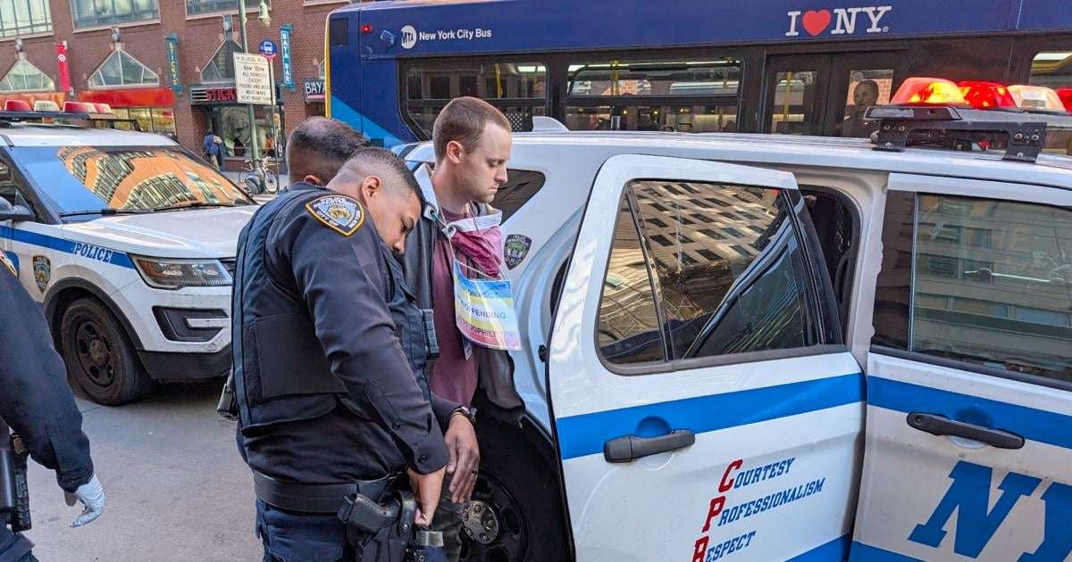 image for Armed man wearing 'non-offending pedophile' sign storms stage at NYC Wikipedia conference