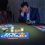 image for A supporter for independent mayoral candidate Andrew Cuomo watches election night returns