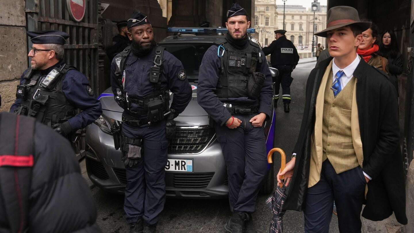image for Fedora man unmasked: Meet the teen behind the Louvre mystery photo